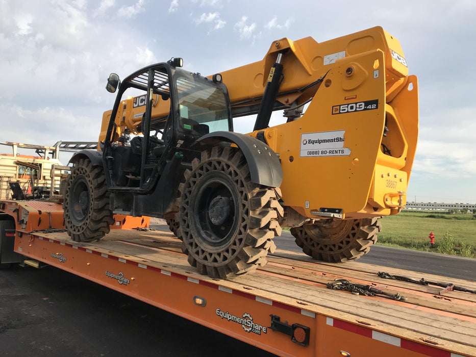 2019 JCB 509-42 74 HP w/Open ROPS, Beacon, Aux Hydraulics, LED Work lights, Solid Tires 66" Carriage/60" Forks