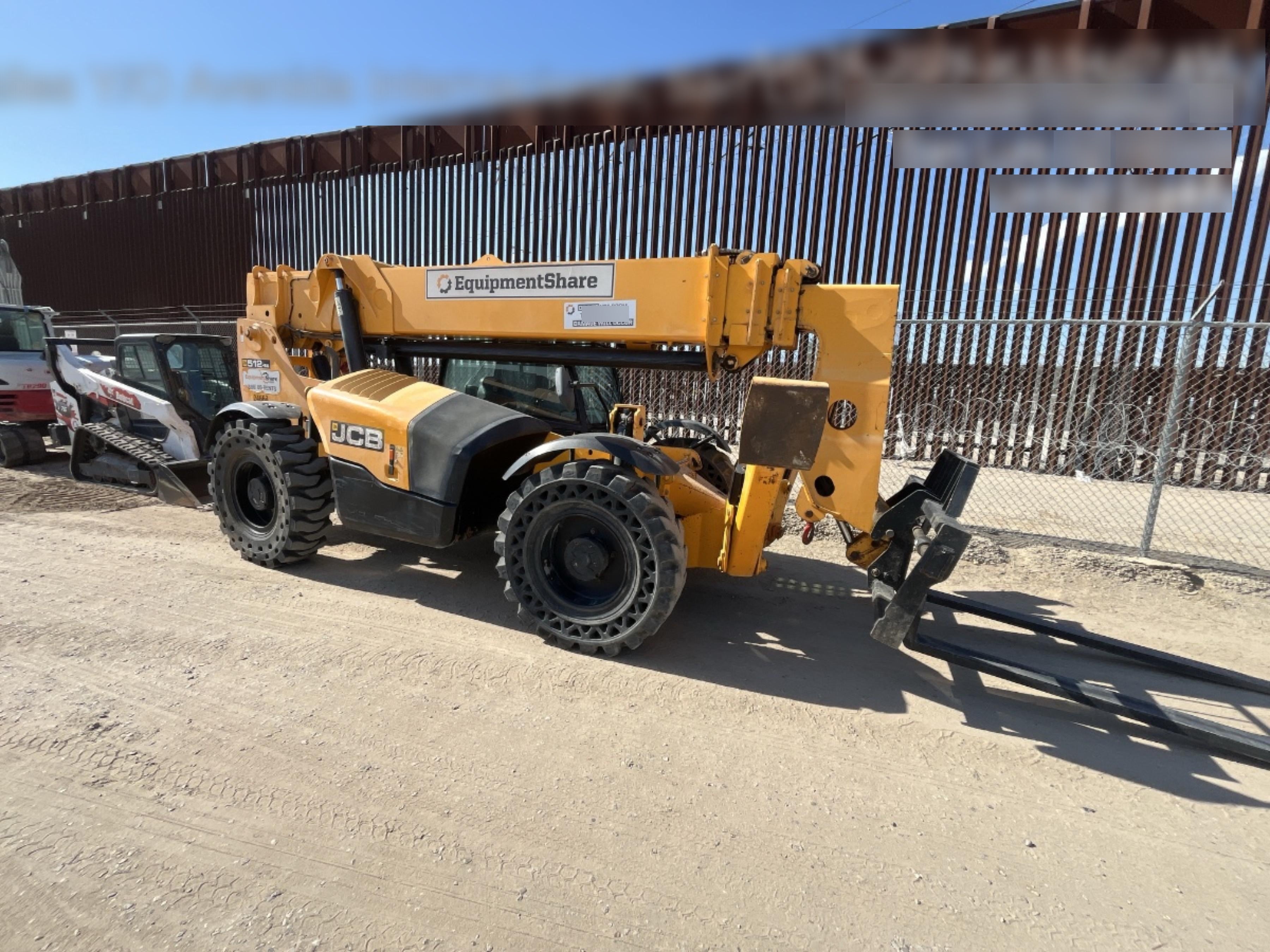 2019 JCB 512-56 74 HP w/CAB/HVAC, Beacon, Aux Hydraulics, Worklights, Solid Tires w/60" Carriage/Forks