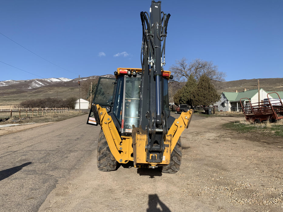 2019 John Deere 410L 4WD, CAB/HVAC, Standard Dipperstick, ISO Controls, Rear Aux Hydraulics, Manual QC w/1.5 Yd Bucket w/Forks, 24" Bucket