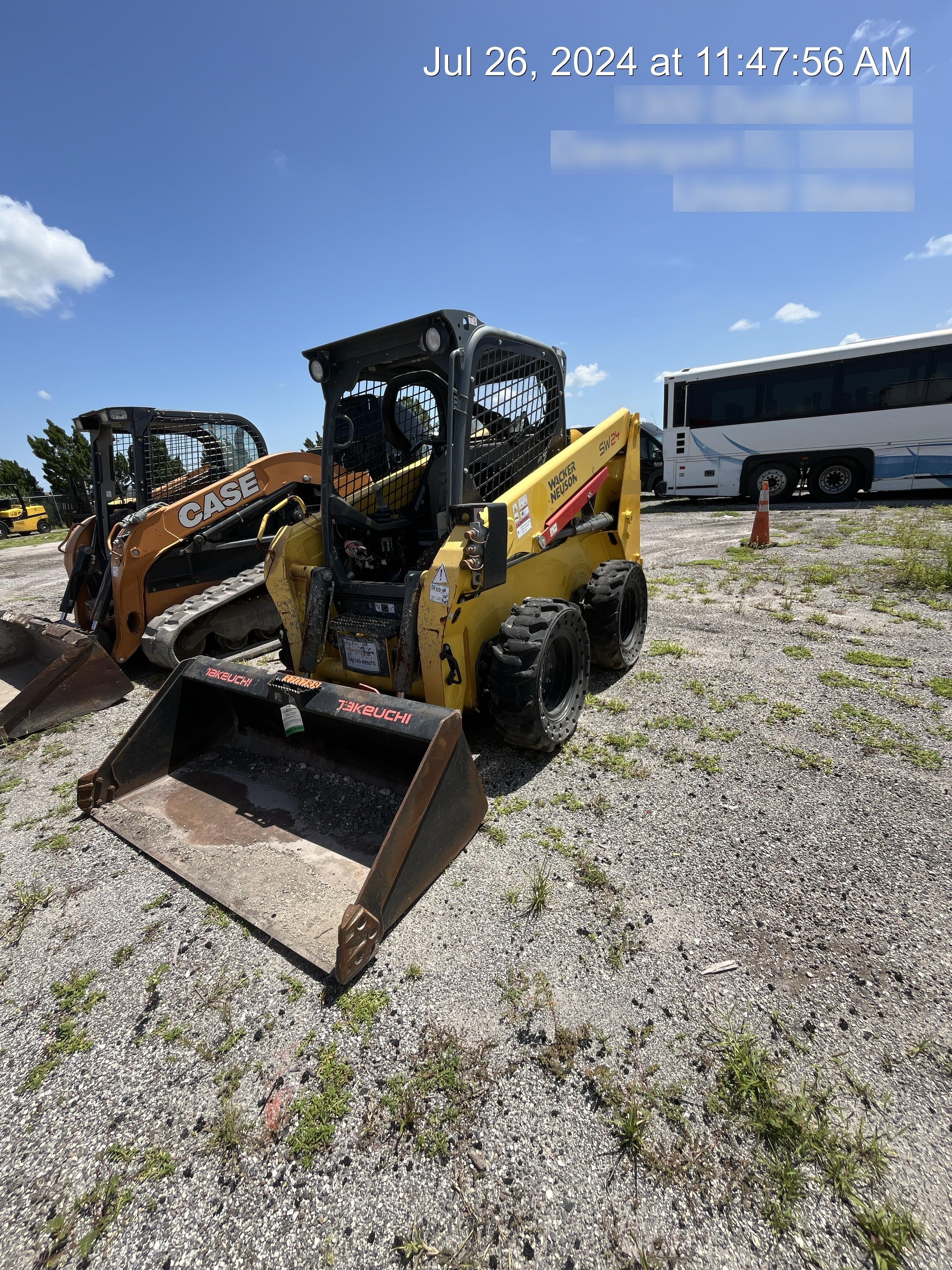 Wacker Neuson SW24 SW24 8k Wheeled Skid Loader, open ROPS, 75" Bucket LP w/ smooth bolt on edge, 72” Angle broom w/universal controller 8 pin