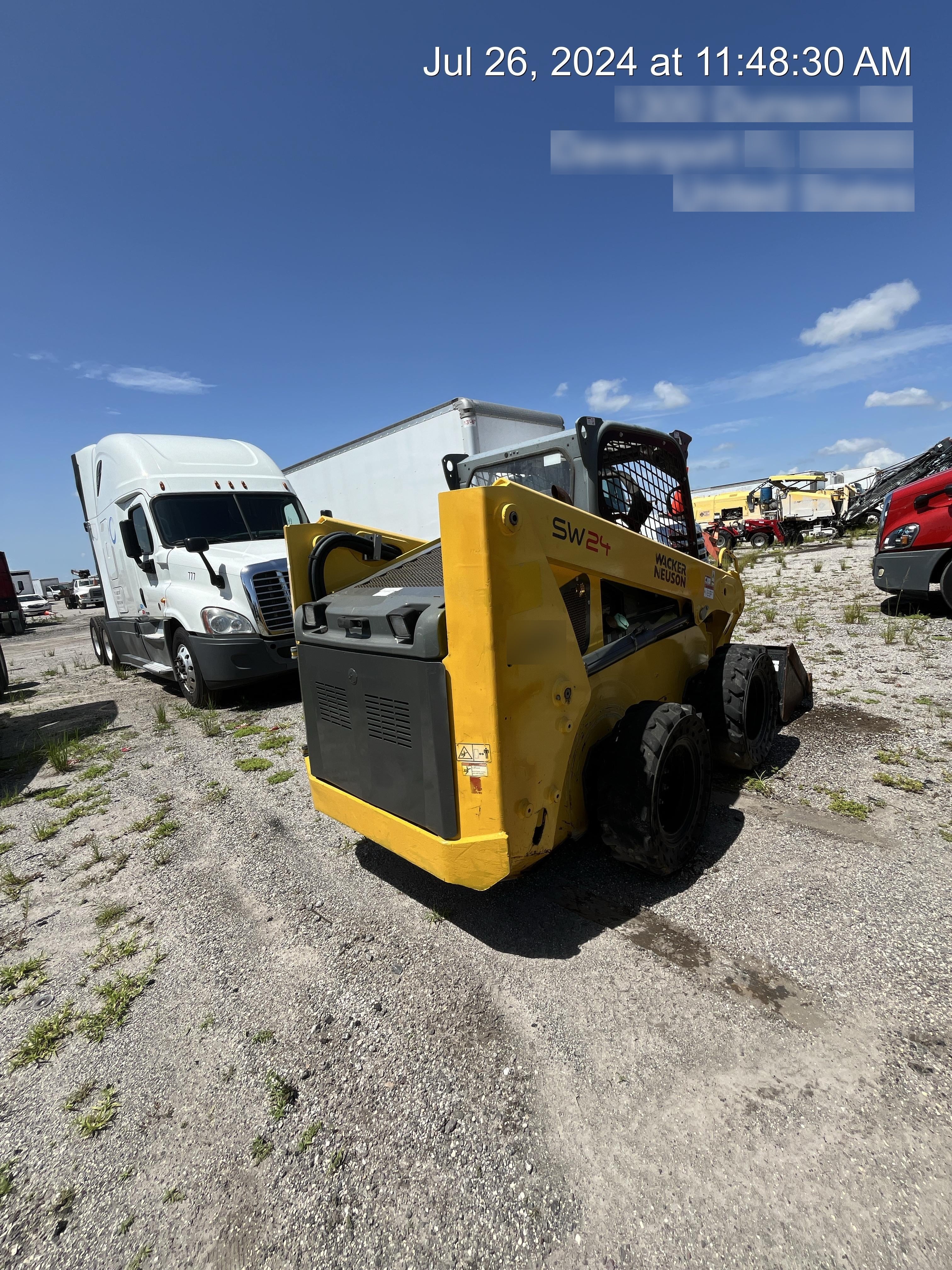 Wacker Neuson SW24 SW24 8k Wheeled Skid Loader, open ROPS, 75" Bucket LP w/ smooth bolt on edge, 72” Angle broom w/universal controller 8 pin
