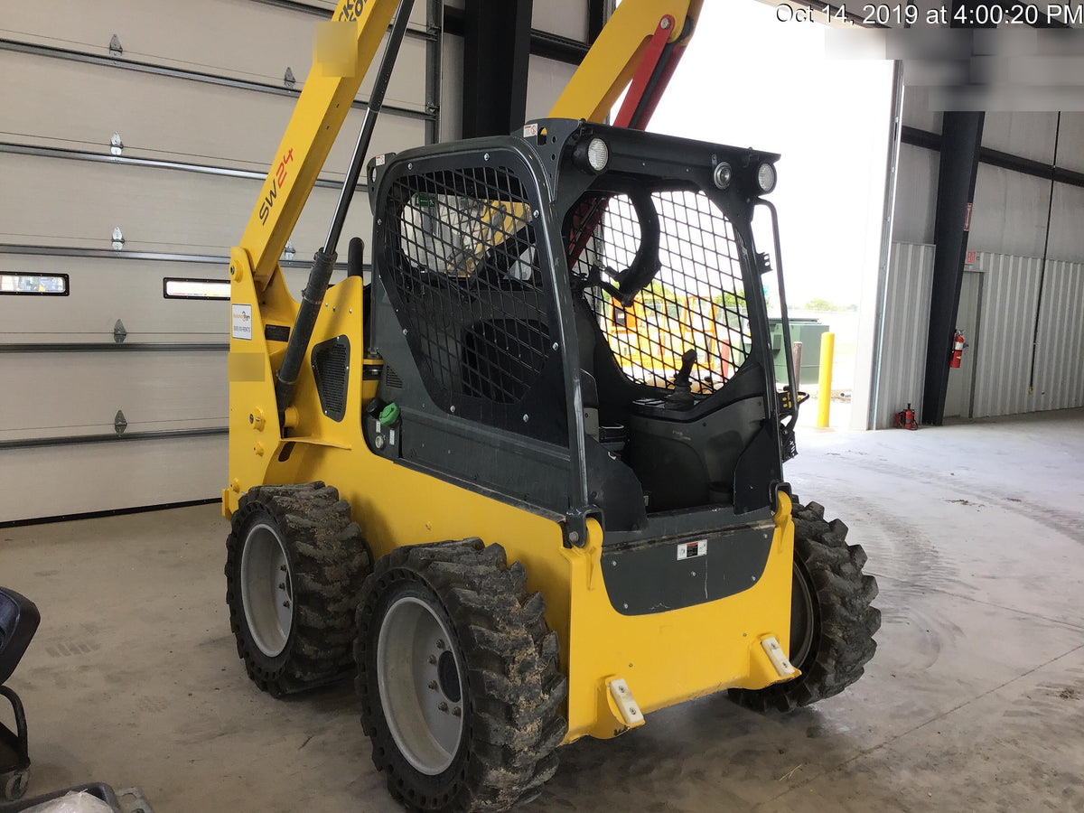 Wacker Neuson SW24 SW24 8k Wheeled Skid Loader, open ROPS, 75" Bucket LP w/ smooth bolt on edge, 72” Angle broom w/universal controller 8 pin