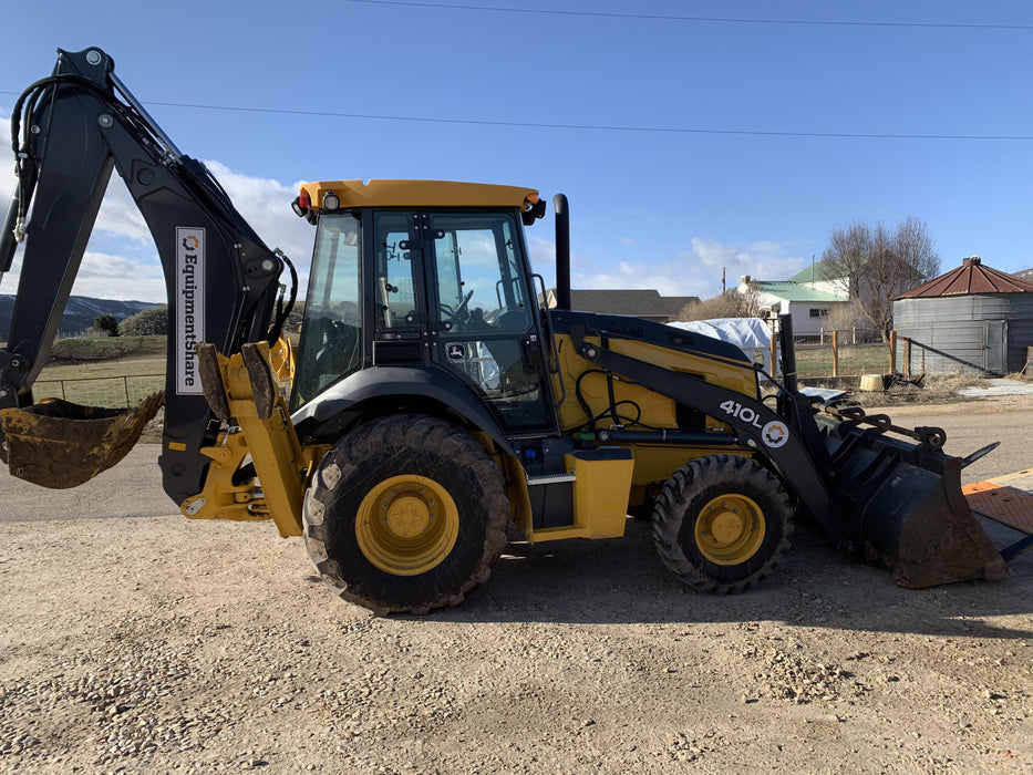 2019 John Deere 410L 4WD, CAB/HVAC, Standard Dipperstick, ISO Controls, Rear Aux Hydraulics, Manual QC w/1.5 Yd Bucket w/Forks, 24" Bucket