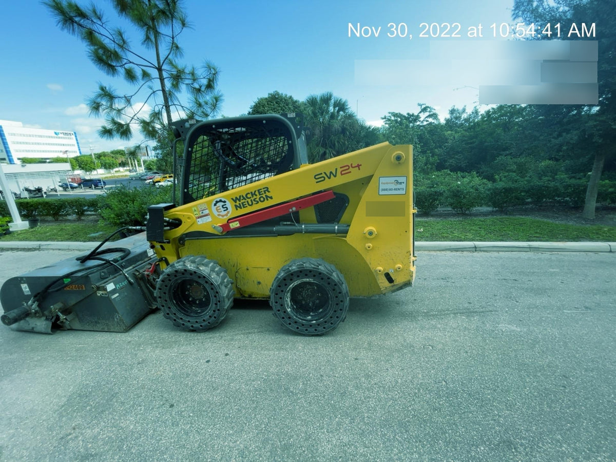 Wacker Neuson SW24 SW24 8k Wheeled Skid Loader, open ROPS, 75" Bucket LP w/ smooth bolt on edge, 72” Angle broom w/universal controller 8 pin