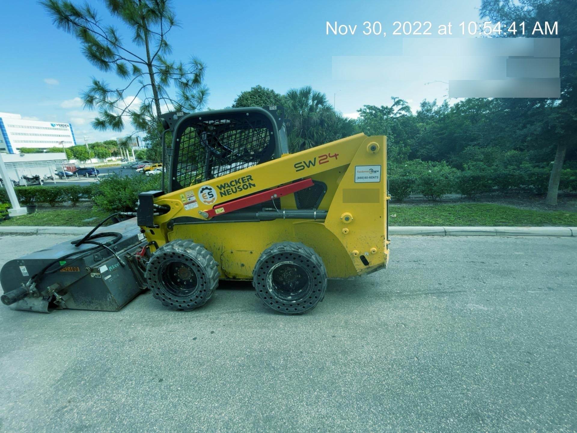 Wacker Neuson SW24 SW24 8k Wheeled Skid Loader, open ROPS, 75" Bucket LP w/ smooth bolt on edge, 72” Angle broom w/universal controller 8 pin