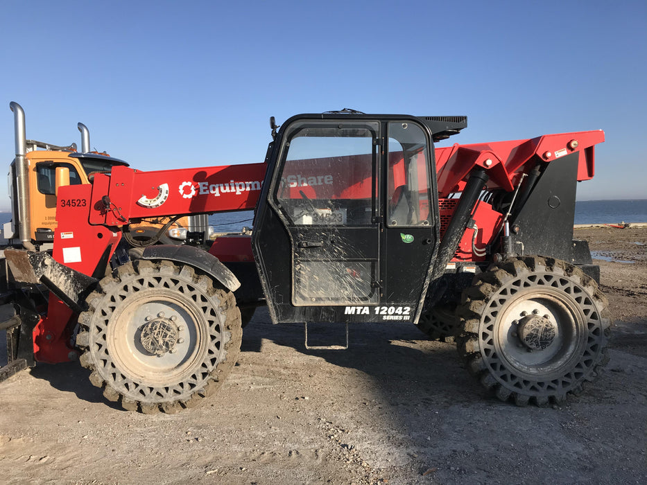 2019 Manitou MTA12042 Cab/Heat/Air, 120 HP, Solid Tires, Work Lights, Lift Hook, Auxiliary Hydraulics 66" Carriage and 60" Forks