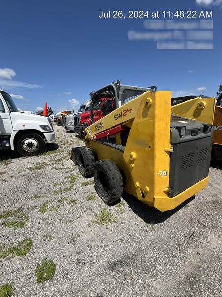 Wacker Neuson SW24 SW24 8k Wheeled Skid Loader, open ROPS, 75" Bucket LP w/ smooth bolt on edge, 72” Angle broom w/universal controller 8 pin