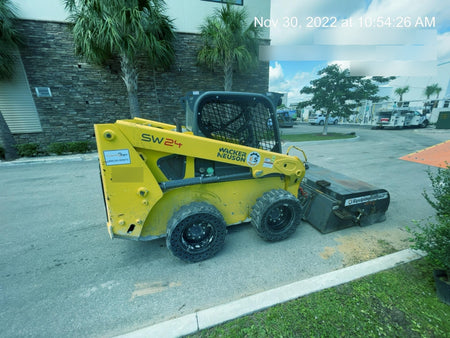 Wacker Neuson SW24 SW24 8k Wheeled Skid Loader, open ROPS, 75" Bucket LP w/ smooth bolt on edge, 72” Angle broom w/universal controller 8 pin