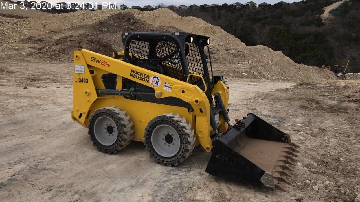 Wacker Neuson SW24 SW24 8k Wheeled Skid Loader, open ROPS, 75" Bucket LP w/ smooth bolt on edge, 72” Angle broom w/universal controller 8 pin